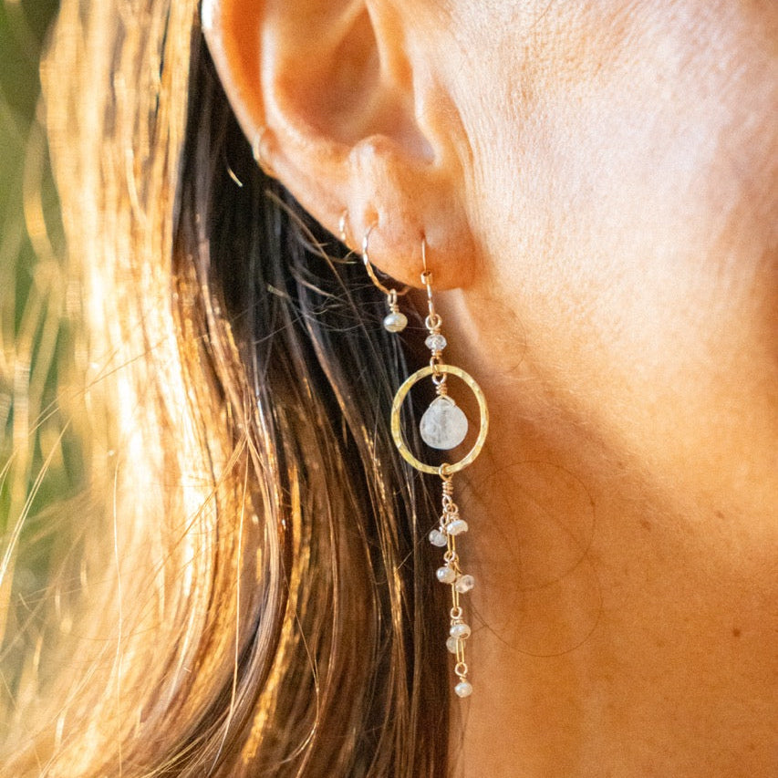 The Hina Earrings worn, moonstone catching the light at the jaw